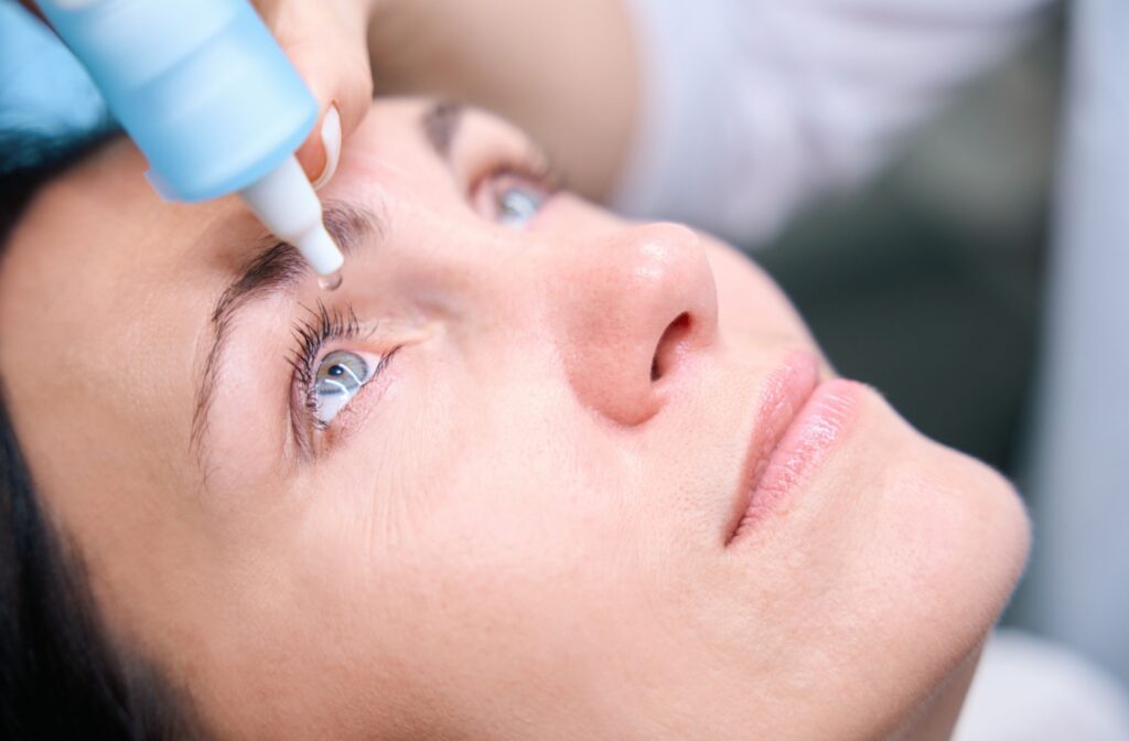 Close-up of a person receiving dilating eye drops during an eye exam.